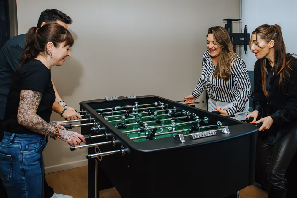 Employees playing table football